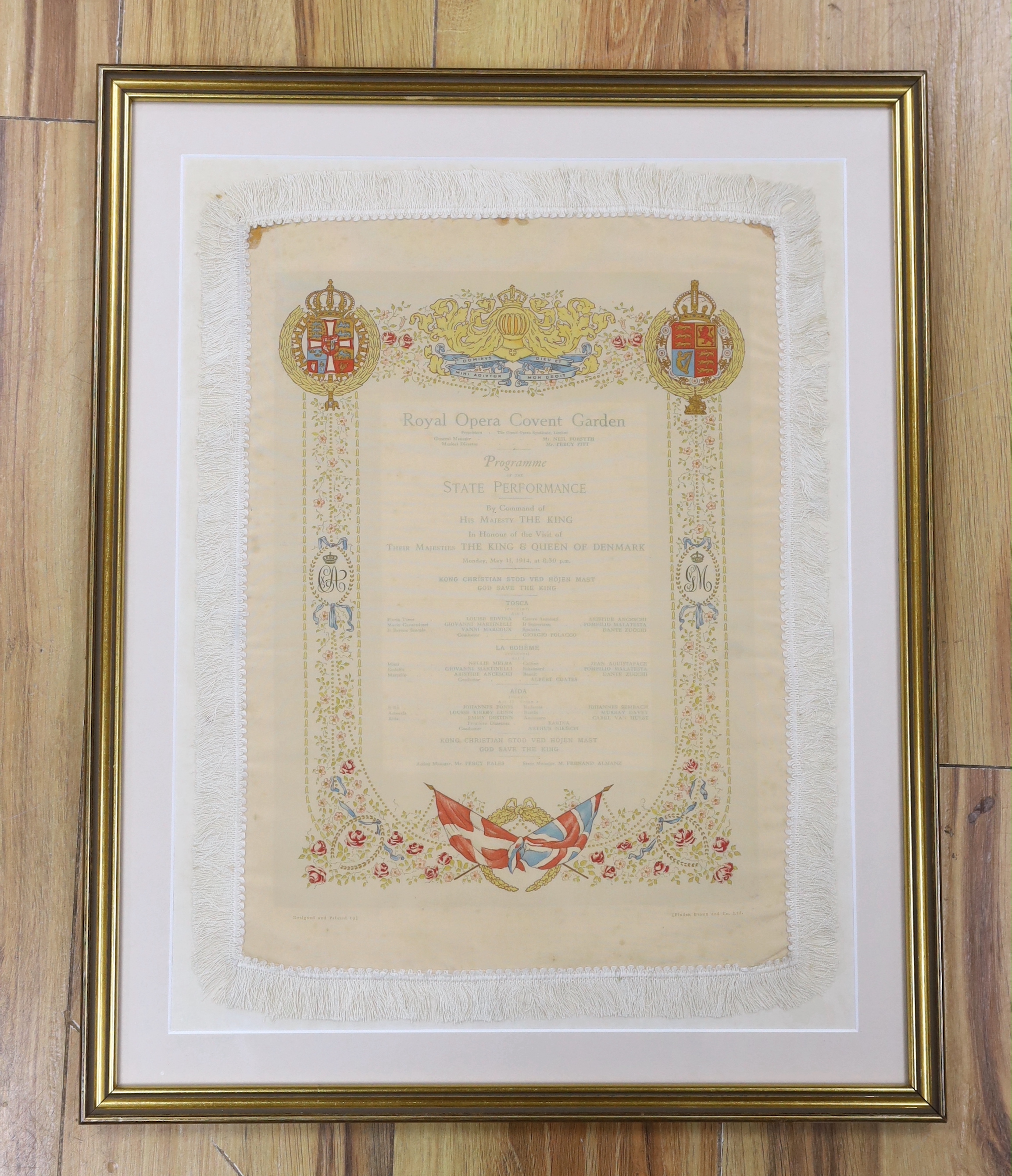 A framed early 20th century silk opera programme, Royal Opera House Covent Garden, State Performance 11th May 1914, printed by Finden Brown & Co., 38 x 27cm not including fringe